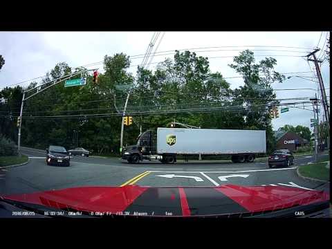 Impatient driver passes ups truck turning left on the left side.
