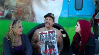 Lacey Sculls with actor Danny Trejo discussing spaying and neutering.