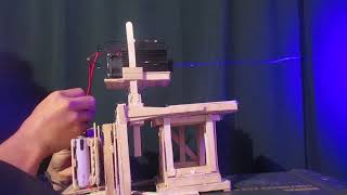 10W Burning Laser module test rig made of popsicle sticks lol