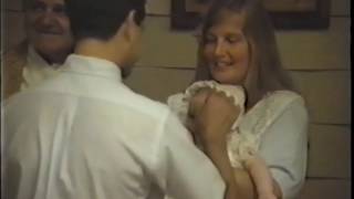 Katie baptized by Father Moore