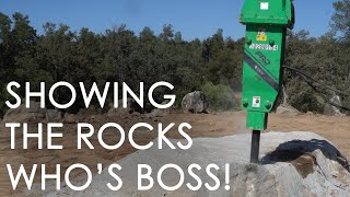 Removing rocks with hydraulic breaker