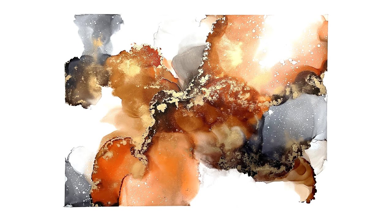 An alcohol ink composition with wispy edges and gold ink. No dryer used ...