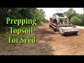 Spreading Topsoil Along A New Concrete Driveway