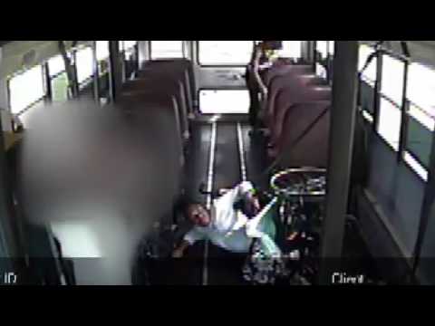 Child in wheelchair falls over on bus; goes ignored