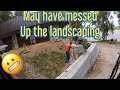 Finishing the retaining wall cutting  a tree and setting  a wood stove with John Deere excavator