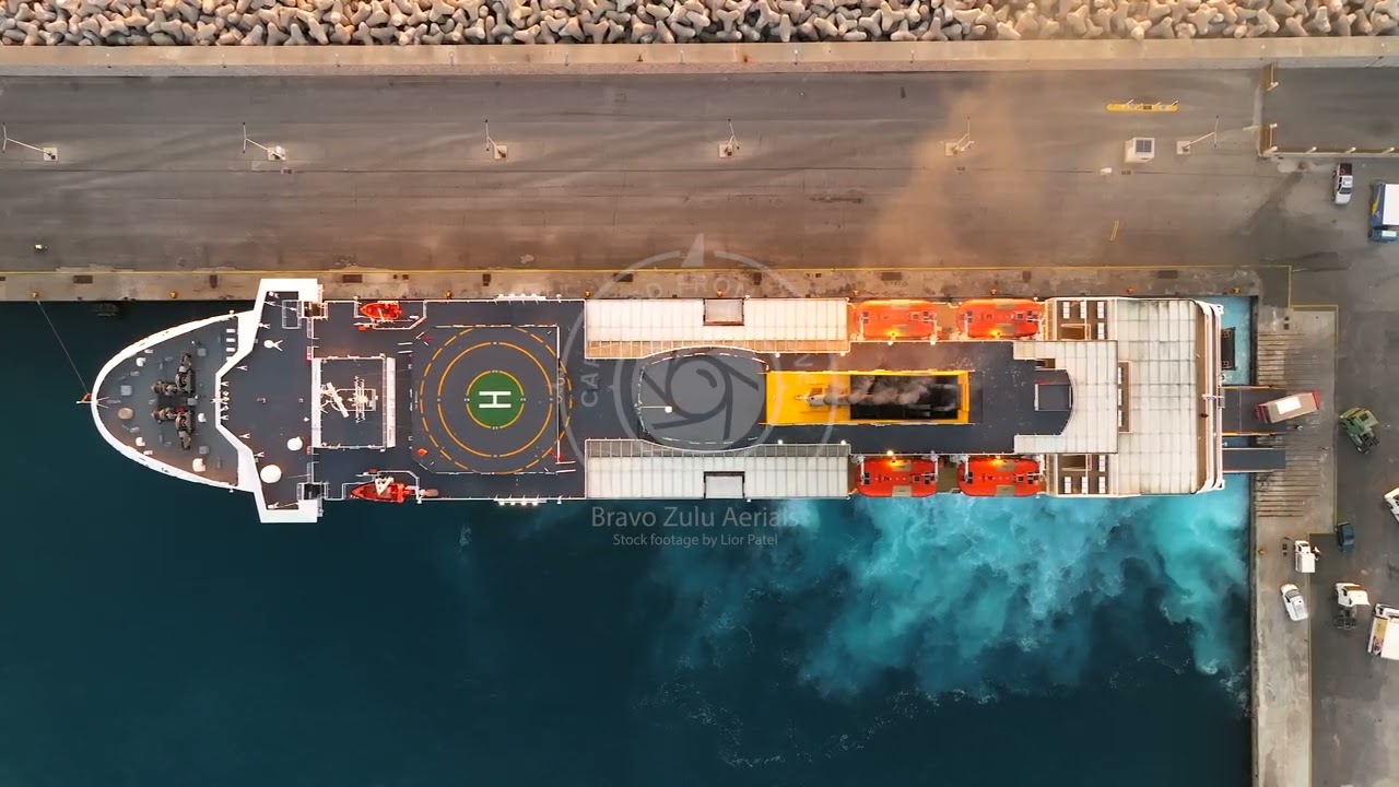 Blue Star Ferries passenger ferry approaching Rhodes island port at sunrise, Aerial view