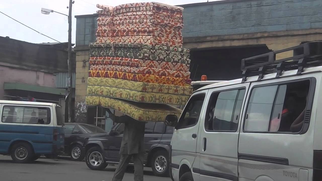 how to carry 20 mattresses on your head YouTube
