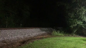 Very fast csx freight train at night