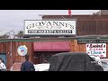 Community members protest outside of giovannis fish market following owners notguilty plead