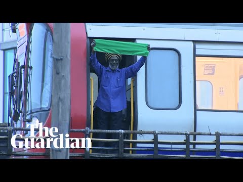 Tube driver halts journey and waves to people holding Grenfell vigil