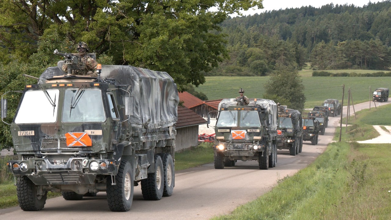 Many US Army trucks travelling in convoys