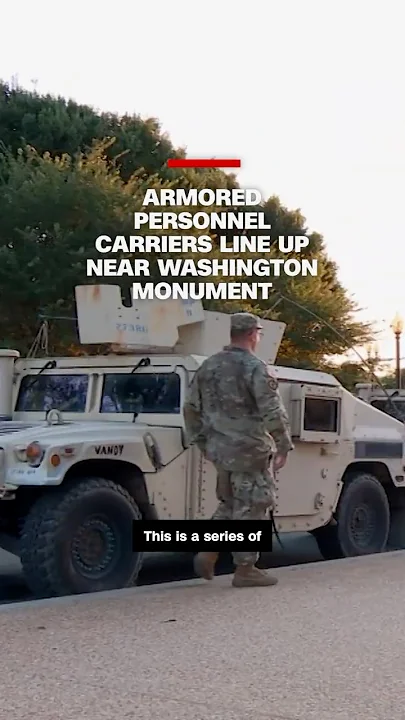 Armored personnel carriers line up near Washington Monument