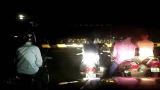 Goods train running with medium speed at Jhilahi crossing at night