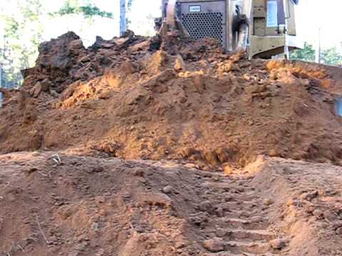Case 1550 Dozer - Pushing a full blade.