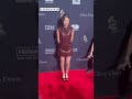 Olivia Rodrigo walking the red carpet at a pre-grammy gala event