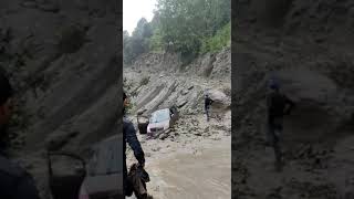 Vehicle stuck in flood in DODA