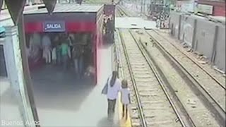 This Mom Lowered Her Daughter Onto Train Tracks...Then A Train Came