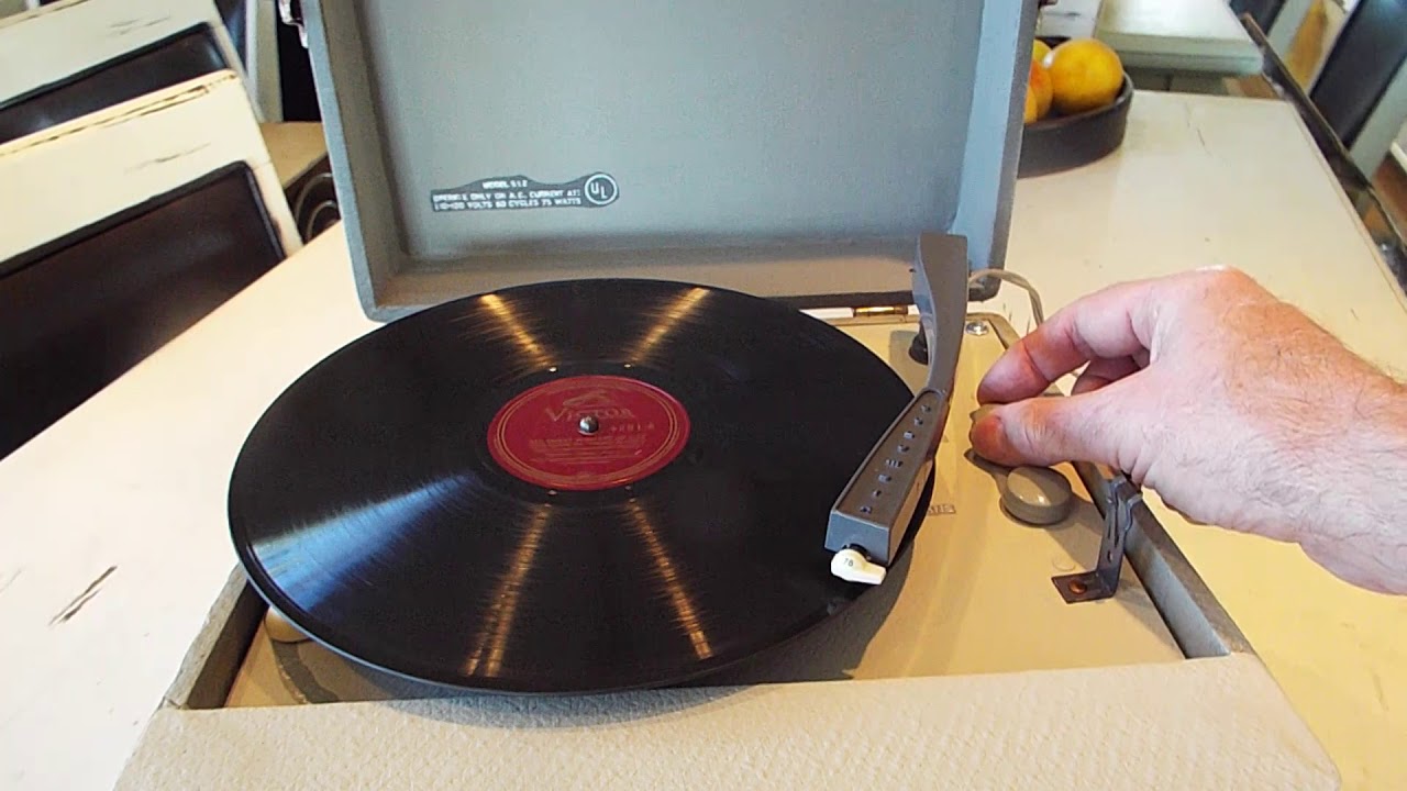 Columbia portable record player playing a 78 RPM record.