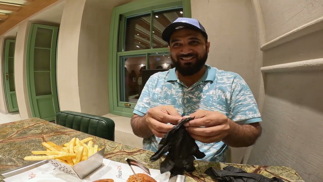 Trying Salt Bae Burger near Galata tower in Istanbul Turkey.