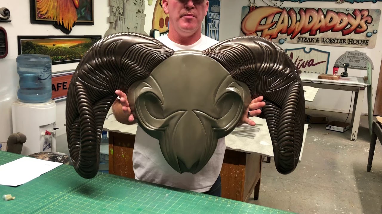 Spraying Plate All on a Custom Sign for Kuiu - Signs by Van