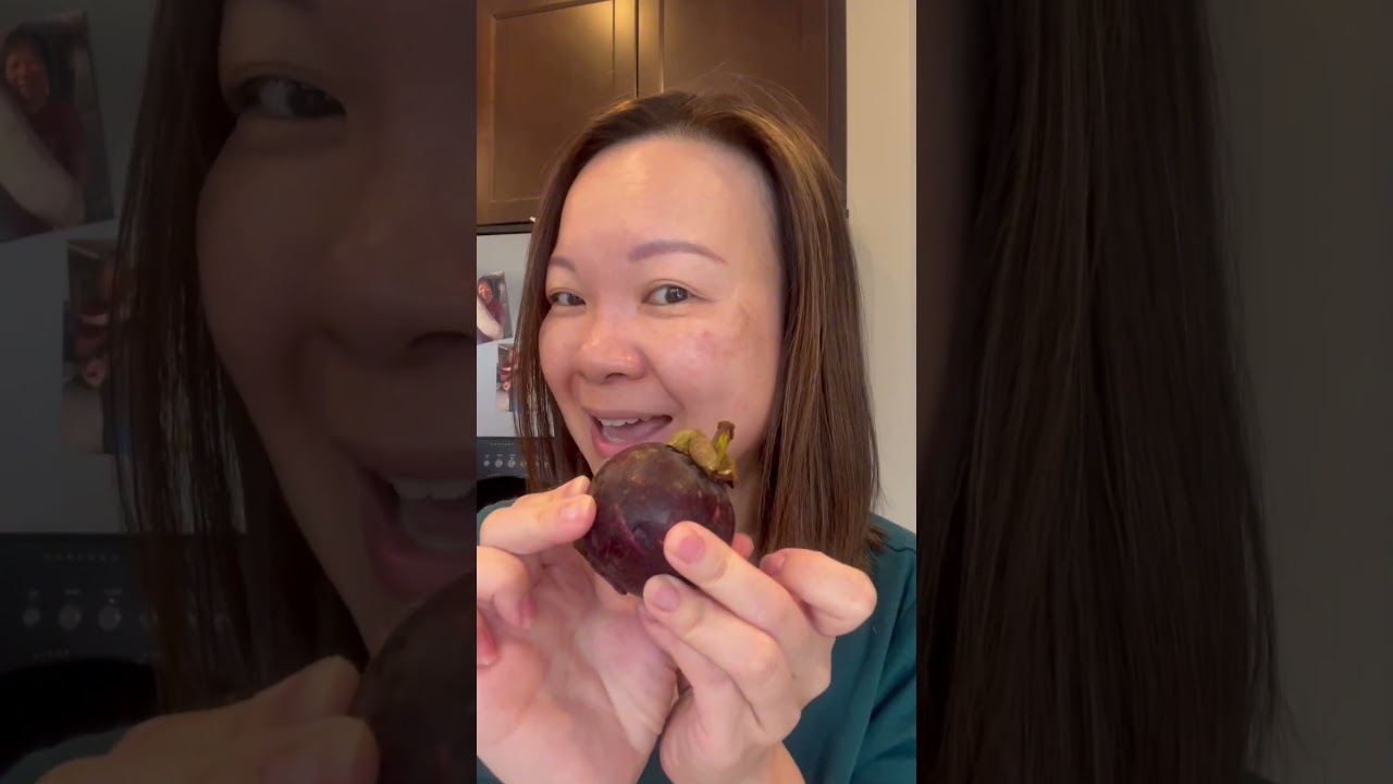 Picking ripe Mangosteen