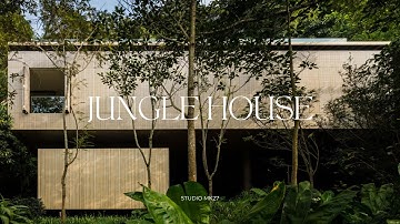 Betonnen huisontwerp met een overloopzwembad op het dak en uitzicht over een regenwoud aan de kust