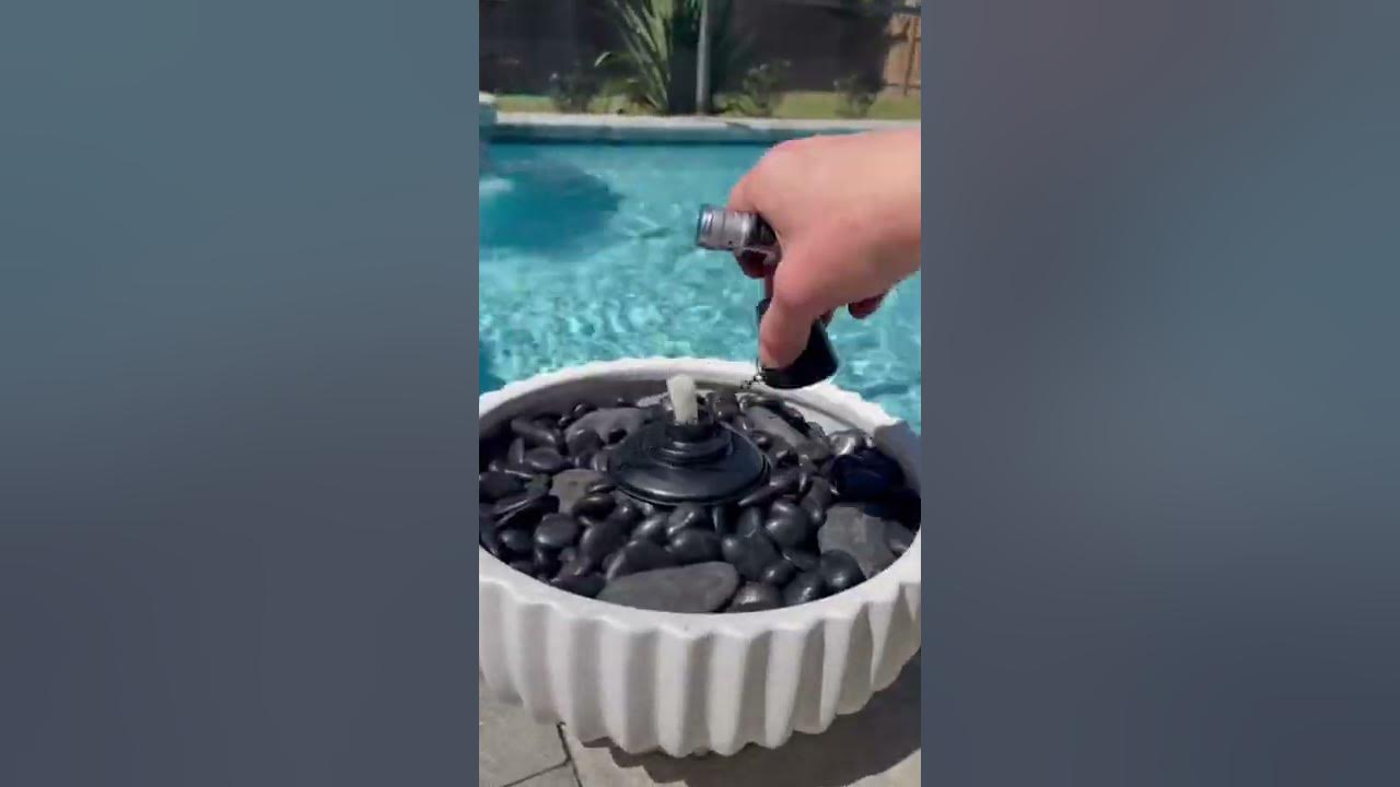 How to make a planter tiki torch with Walmart planters and rocks. #pool