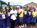 Serena Hotels&#39; Lake Elementaita Serena Camp staff hand over books to Nderit Primary School