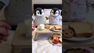 Two Baby Penguins Eating Apples