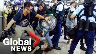 Hong Kong police face off with protesters as airport protests erupt in chaos