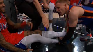 Kelly Oubre Jr can't stop laughing while Donte DiVincenzo trips him and starts fight