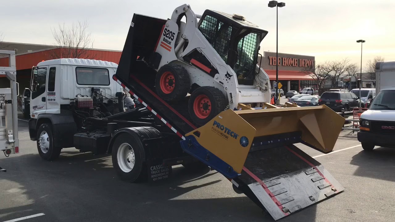 Isuzu Fvr Hooklift Truck Transporting Bobcat S205 With 10 Ft Protech