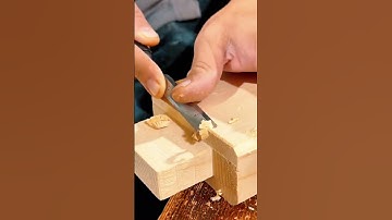 Shaving smooth edges on a wooden joint using a sharp chisel tool