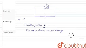 A parallel plate capacitor is connected to a battery and inserted a dielectric plate between the...