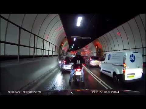 Shocking moment cyclist branded 'stupid c**t' weaves through traffic in London's Blackwall Tunnel