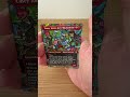 Opening a Teenage Mutant Ninja Turtles Play Booster.
