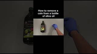 How to remove a coin from a bottle of olive oil #coin #oliveoil