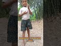 Kid casually play with a snake on a jungle