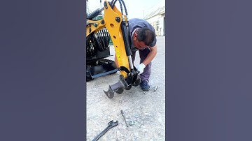 mini excavator with rake