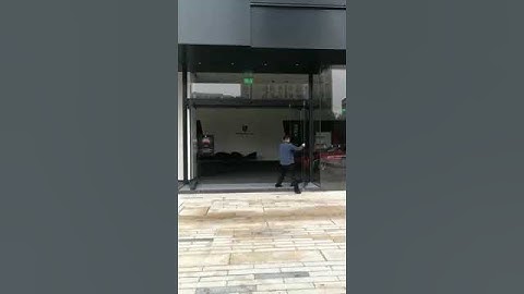 Emergency breakout automatic sliding glass door system. People can easy swing out the door