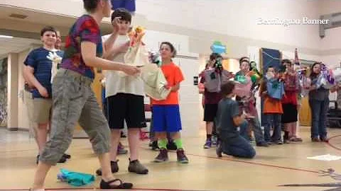 Barbara Paulson leads the puppet parade event at F...