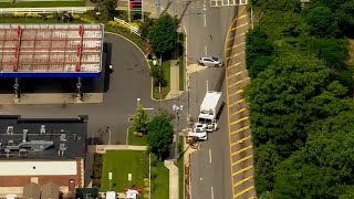 At least 1 killed when garbage truck crashes into school bus, cars
