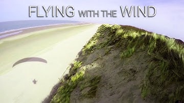 Flying with the wind (paragliding on dunes)