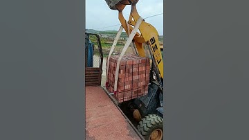The process of unloading red bricks- Good tools and machinery make work easy