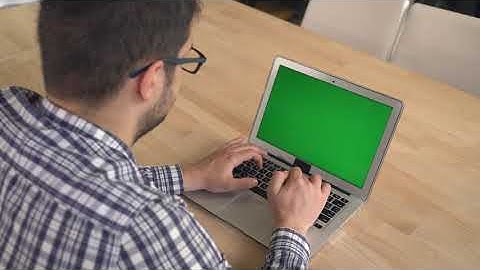 Businessman With Black Hair And Glasses Typing On The Laptop With Green Screen Male Fingers  Free