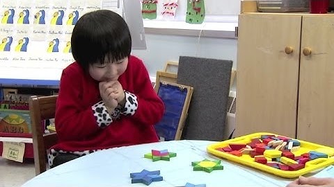 Composing Shapes with Child 12 (Early Math Collaborative at Erikson)