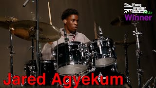 Young Drummer of the Year 2024 - WINNER! - Jared Agyekum
Jared Agyekums winning performance at the 2024 Final of the Young Drummer of the Year Event held in the UK.
All entrants must be under 16 and send in a video of themselves playing. A shortlist of 40 is decided, then the top 10 are chosen to come and play in front of a panel of professional players and music industry heavyweights. Not only do they perform a solo, an accompaniment to some prerecorded music, and a live piece with 2 other musicians (a piece of music that they only heard the morning of the event); but they are also have an informal chat with the judges about music and themselves.
The event, this year, is kindly sponsored by Gretsch Drums, Zildjian Cymbals, GEWA Bags & Cases, Gibraltar Hardware and Vic Firth drumsticks.
Track one - Written by Kaz Rodriguez just for this event.
Track two Live - Written and performed on bass for the event by Stefan Redtenbacher and on Guitar James Pusey.
Filmed at the Lighthouse Arts Centre in Poole, Dorset UK Young Drummer of the Year 2024 - WINNER! - Jared Agyekum