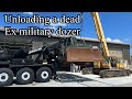 Unloading a very low hour ex military 850J John Deere dozer that does not run with HET wrecker/crane