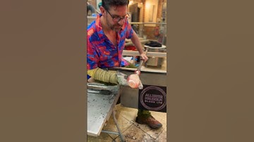 #glassblowing with #silverleaf creating a #fish scale #pattern on a mermaid bottle design. #glassart