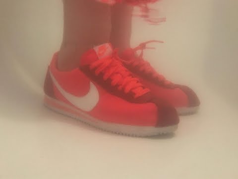 Her Nike Cortez in bath